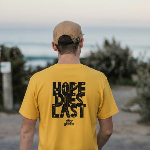 ZeitStitch Back-Marquee “Hope Dies Last” Chest-Micro Tee