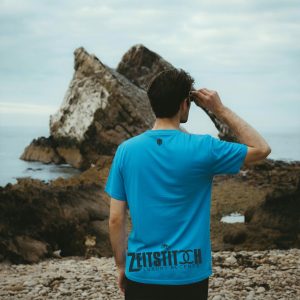 ZeitStitch Back-Hem Banner “Believer” Quad-Placement Tee